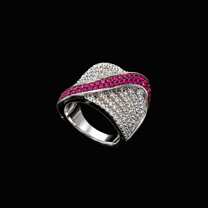 A silver ring with clear CZ stones and enamel work, featuring a geometric design.