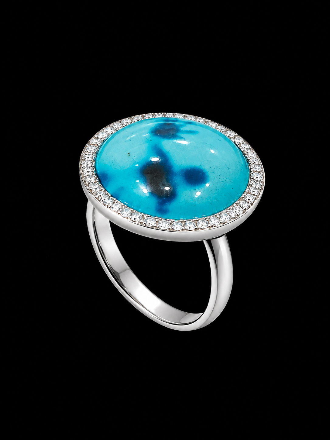 A silver ring with an enamel design and CZ stones on a black background