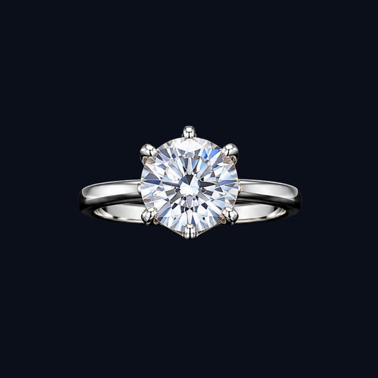 A silver ring with a large round-cut cubic zirconia stone set in a four-prong setting.