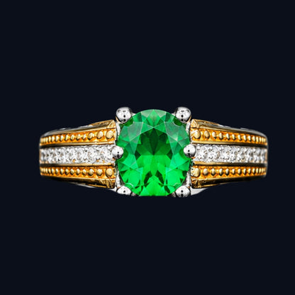 A gold-plated ring with a round-cut green CZ gemstone.