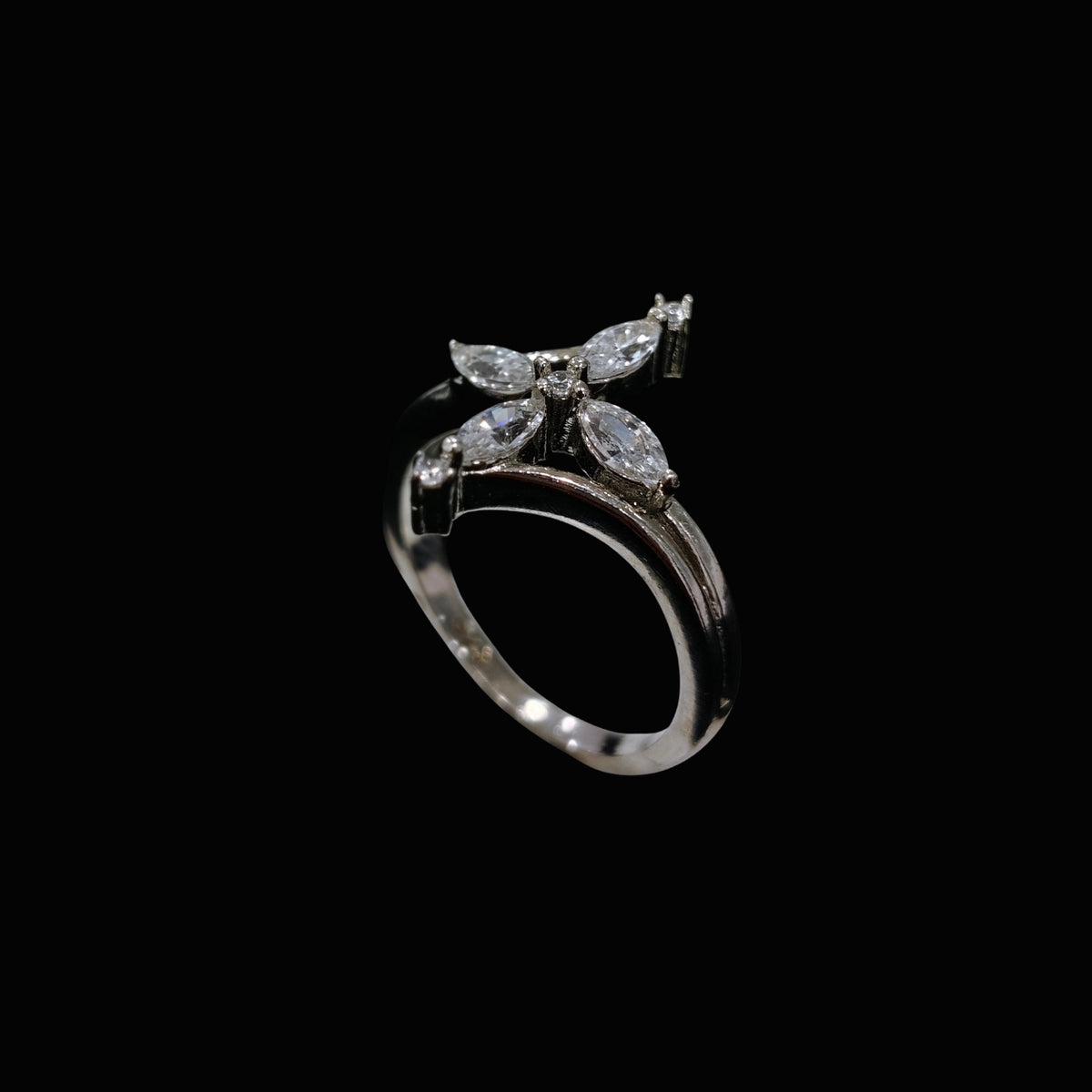 A silver ring with a butterfly design and clear CZ stones.