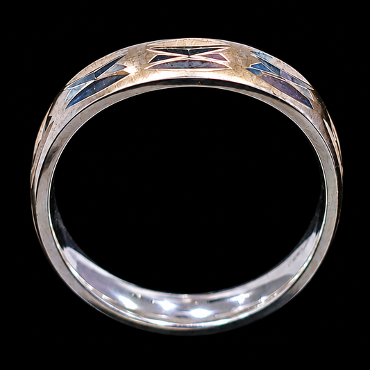 A silver ring with enamel work, featuring a geometric design and CZ stones.