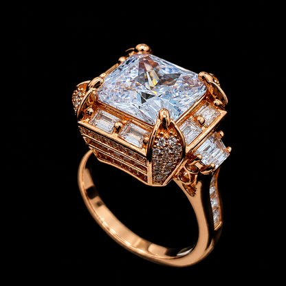 A gold-tone ring with a large clear CZ stone and smaller stones surrounding it.