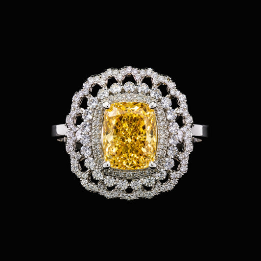 A yellow CZ ring with a large yellow stone and white CZ accents, set in a silver-tone setting.