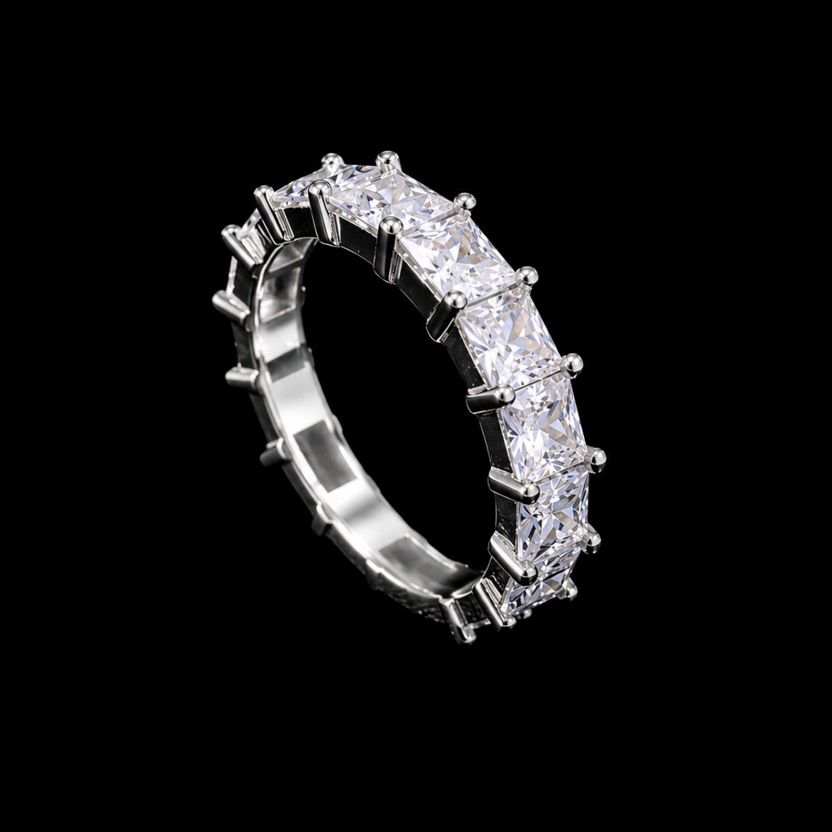 A silver ring with a row of clear cubic zirconia stones.
