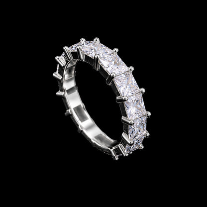 A silver ring with a row of clear cubic zirconia stones.
