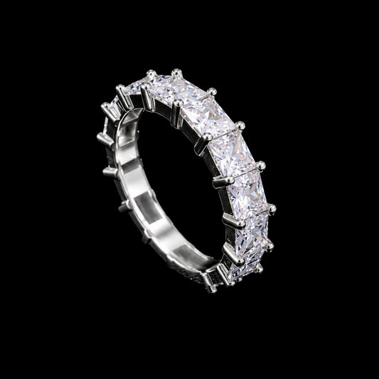 A silver ring with a row of clear cubic zirconia stones.