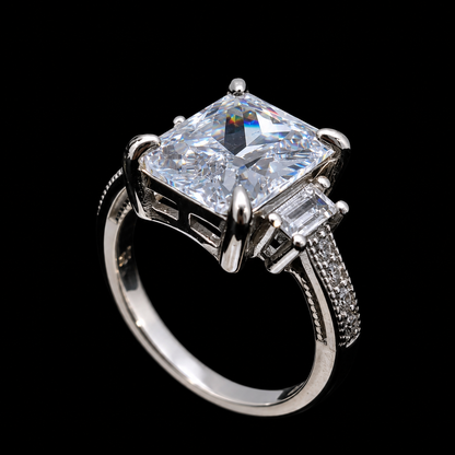 A silver ring with a large cubic zirconia stone and small accents.