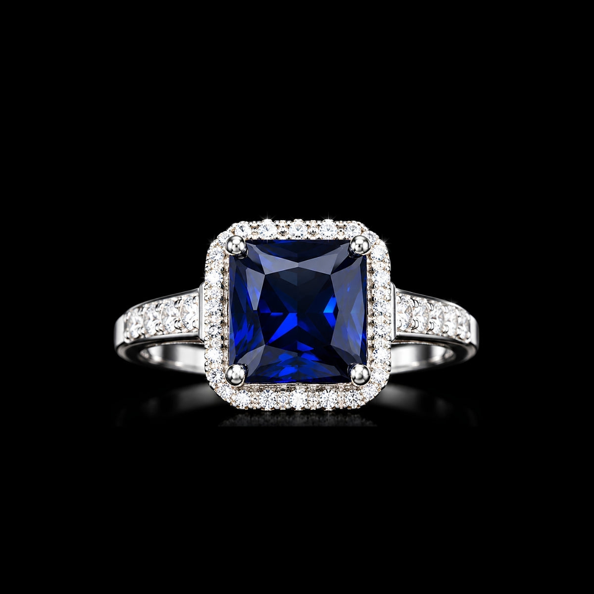 A silver-tone ring featuring a large blue square-cut CZ stone surrounded by smaller clear CZ stones.