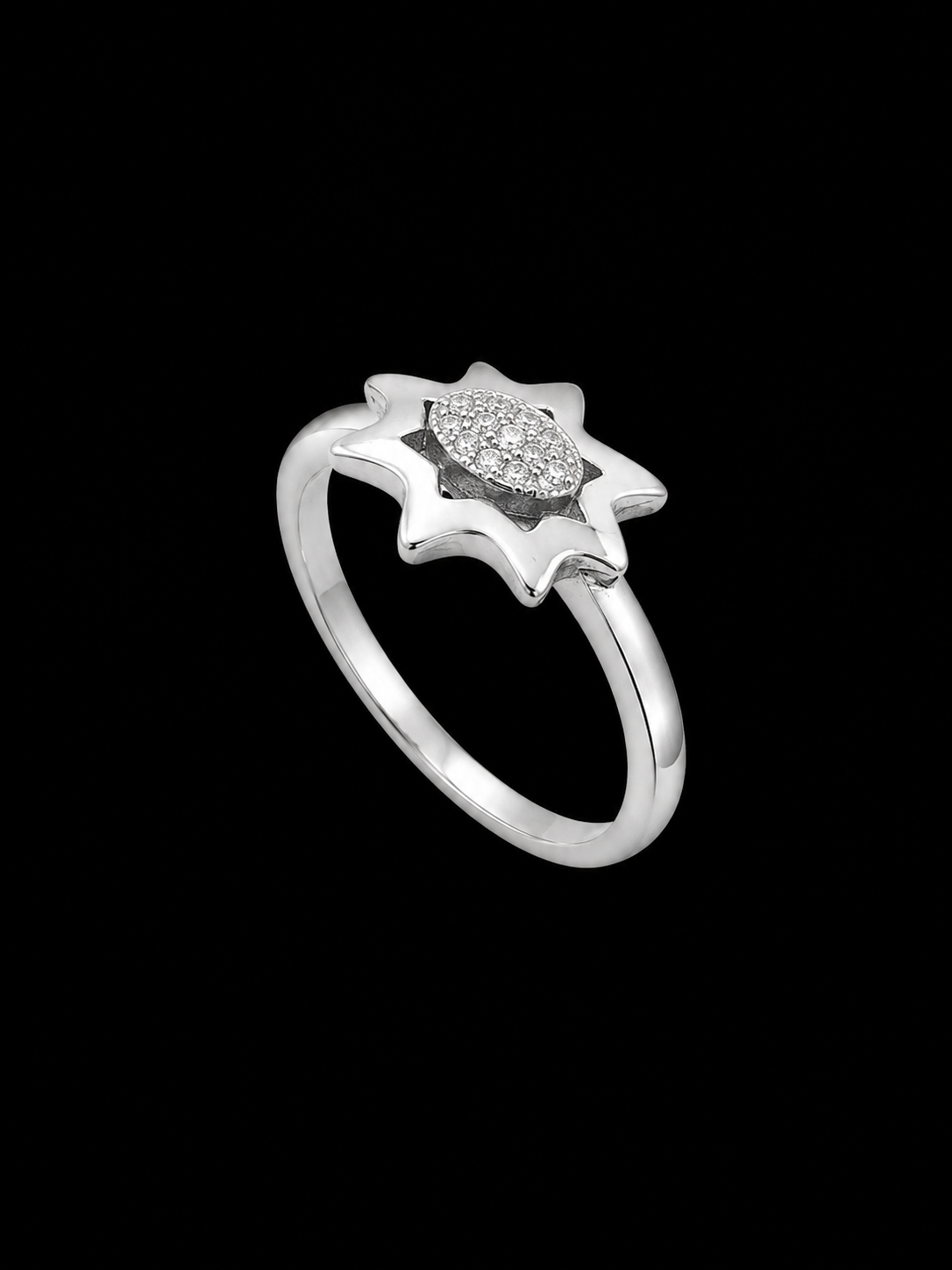 A silver ring with a flower design and CZ stones on a black background
