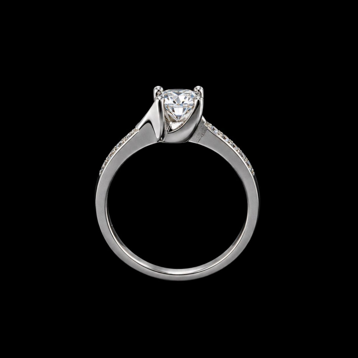 A silver ring with a large clear cubic zirconia stone and smaller stones on the band.