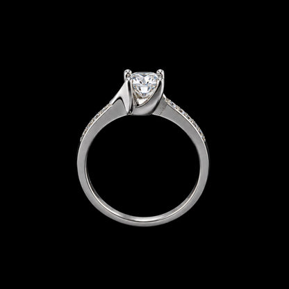 A silver ring with a large clear cubic zirconia stone and smaller stones on the band.