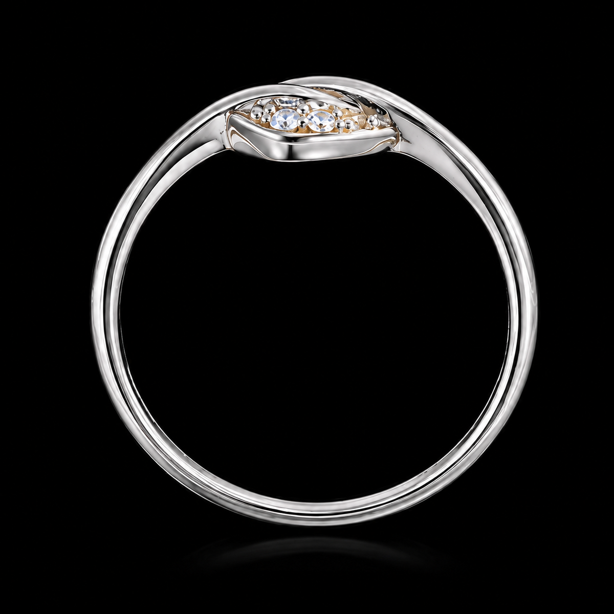 A silver ring with a cluster of clear cubic zirconia stones on a black background.