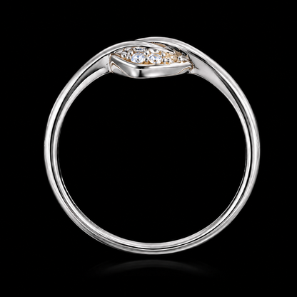 A silver ring with a cluster of clear cubic zirconia stones on a black background.