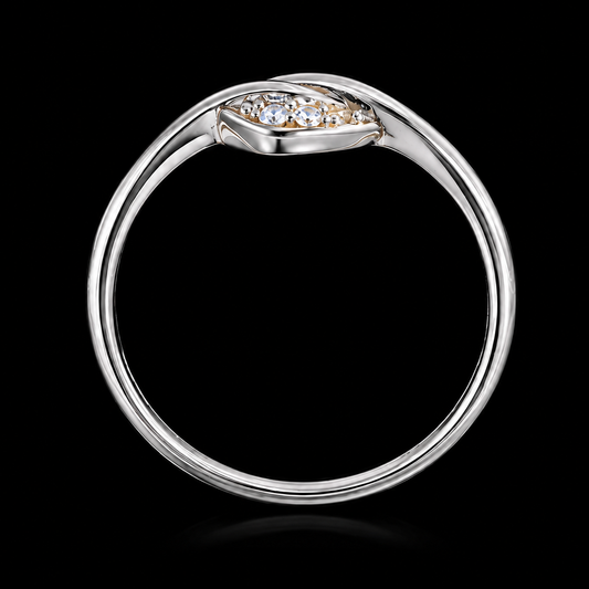 A silver ring with a cluster of clear cubic zirconia stones on a black background.