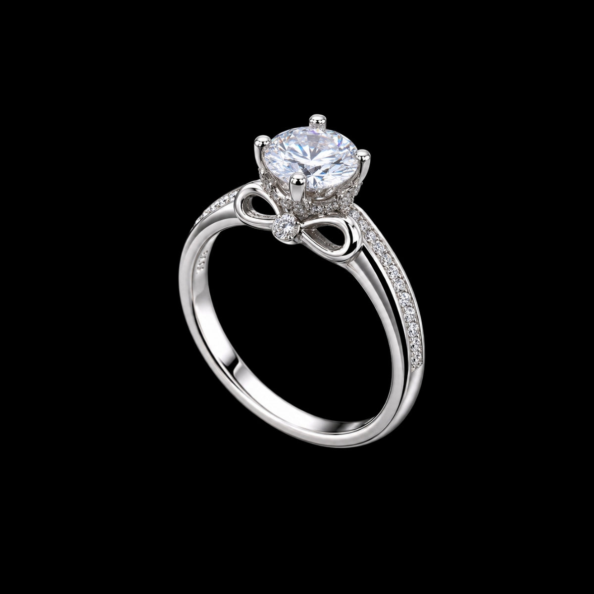 A silver ring with a CZ stone at its center, surrounded by a bow design.