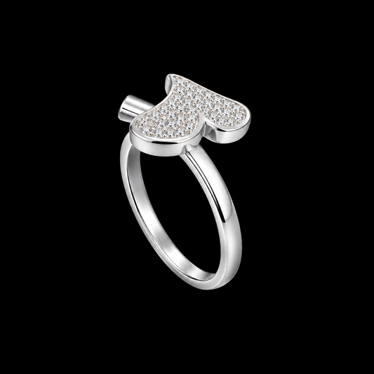 A silver ring with a CZ stone design on a plain background