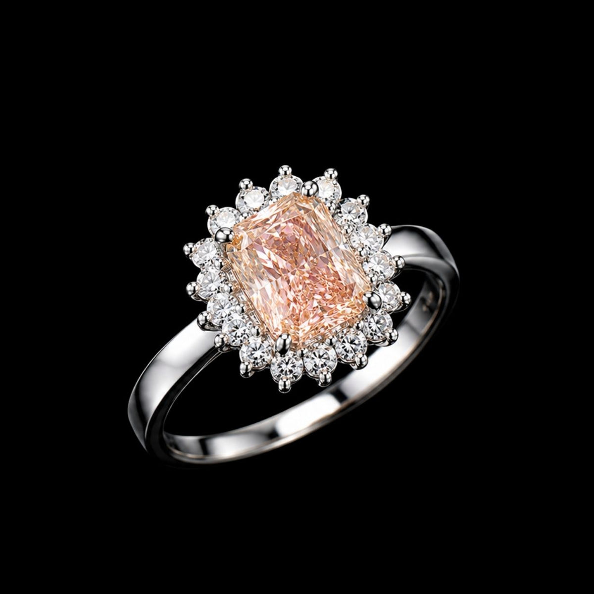A silver ring with a peach CZ stone and clear CZ halo on a black background.