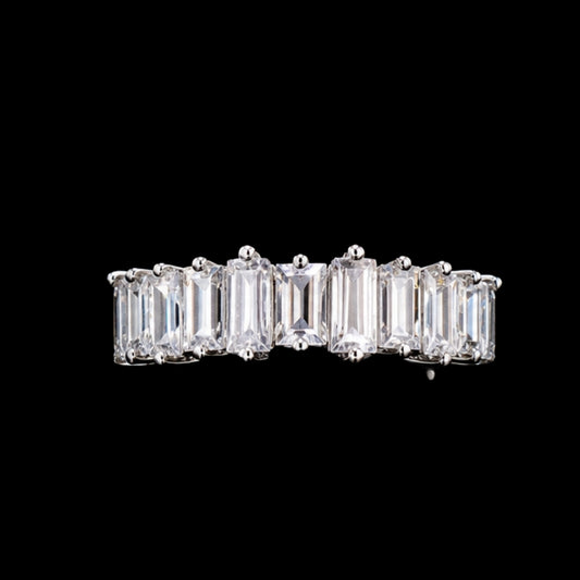 A silver-tone ring featuring multiple clear CZ stones in a geometric design.