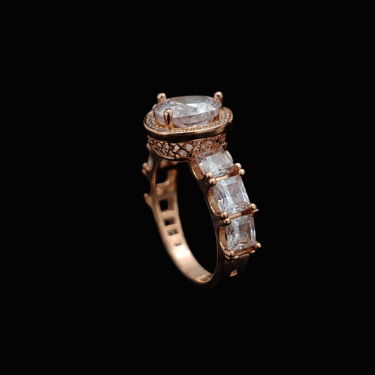 A rose gold ring with a large clear CZ stone and intricate filigree details.