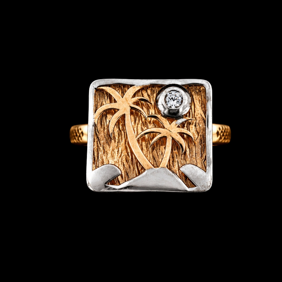 A gold-tone and silver-tone ring with a tropical island design and CZ stone.