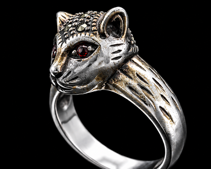 A silver ring with a fox motif and red CZ eyes.
