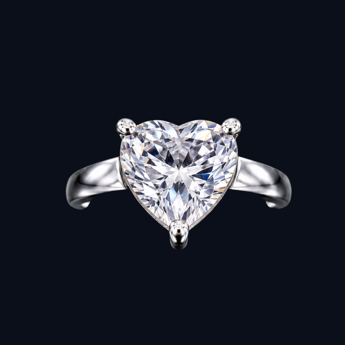 A silver ring with a heart-shaped clear CZ stone.