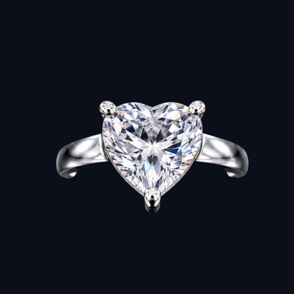 A silver ring with a heart-shaped clear CZ stone.