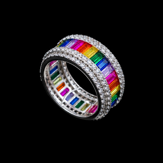 A silver ring with a rainbow design and cubic zirconia stones.