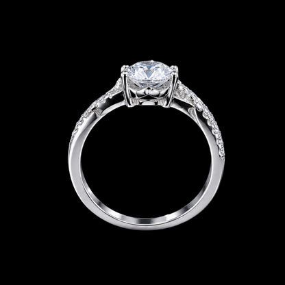 A silver-tone ring with a large clear CZ stone and smaller stones on the band.