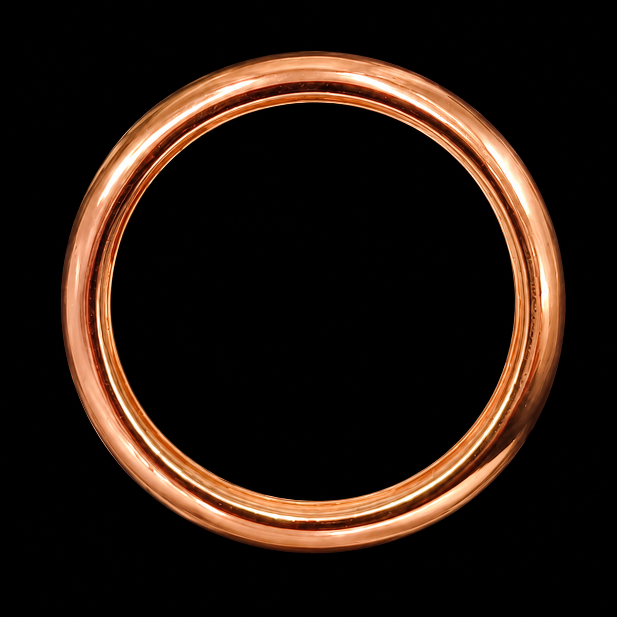 A copper ring with a smooth, shiny finish.