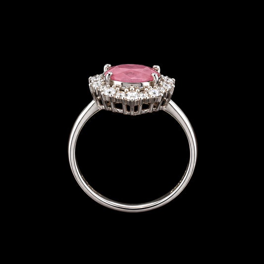 A silver-tone ring with a pink CZ stone and clear CZ stones around it.