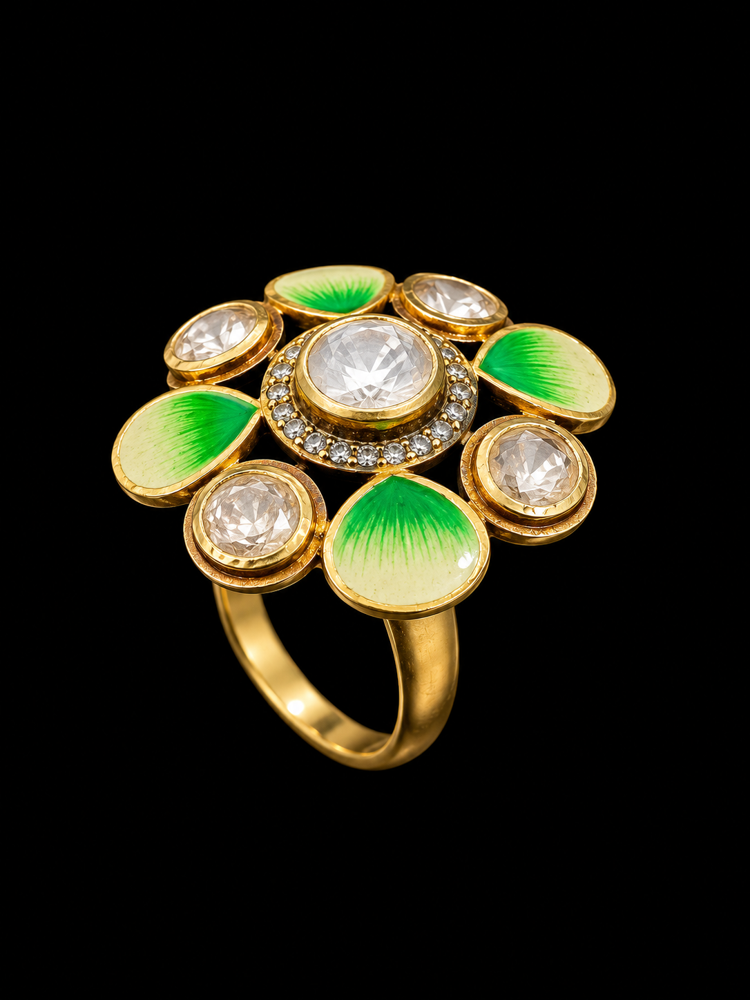 A gold-tone ring with enamel and cubic zirconia stones, featuring a floral design.