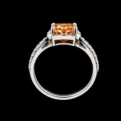 A silver ring with a large CZ stone, set in a simple design.