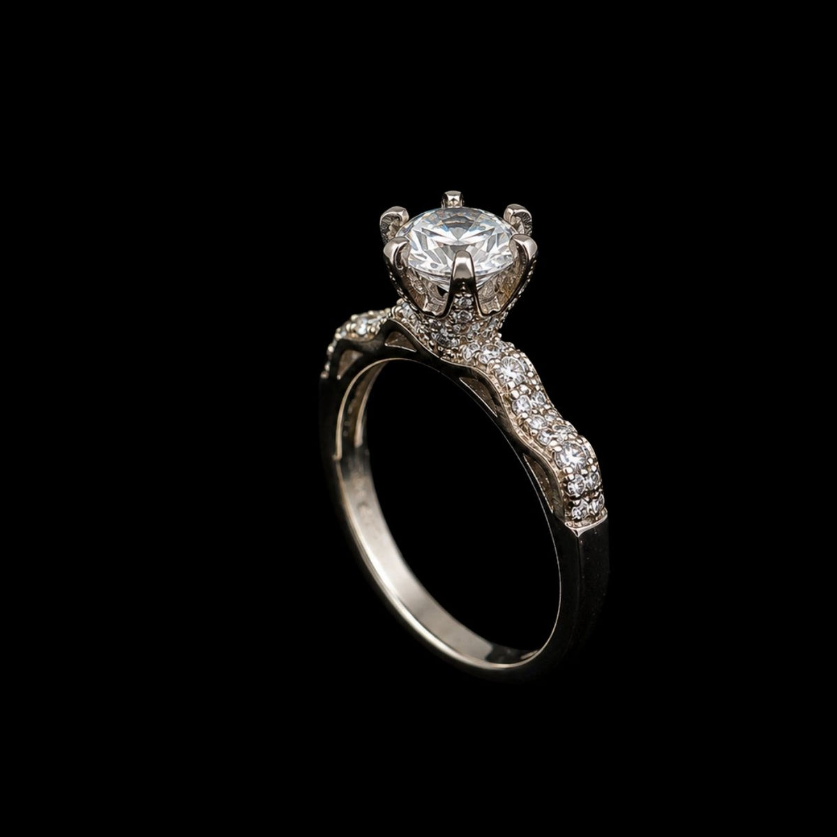 A silver-tone ring with a large round-cut CZ stone at its center, surrounded by smaller CZ stones along the band.