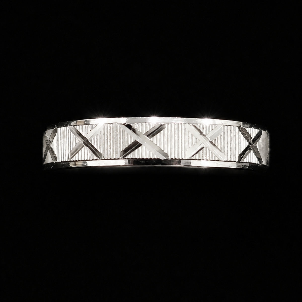 A silver band with an X motif, perfect for everyday wear or as a gift.