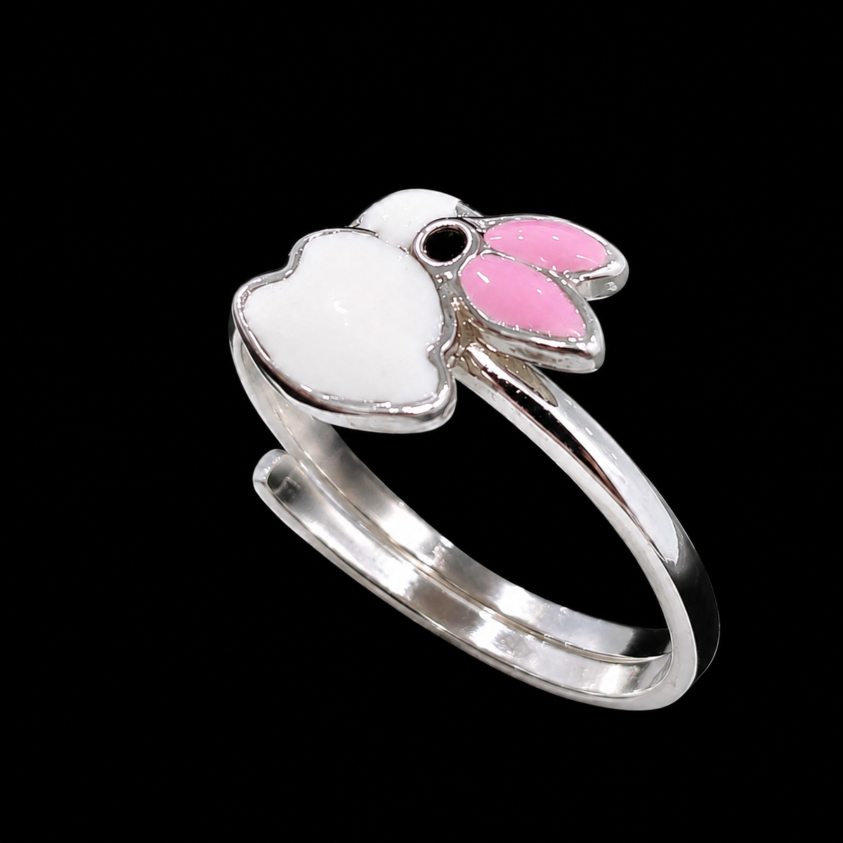 A silver ring with a flower motif featuring white and pink enamel details.