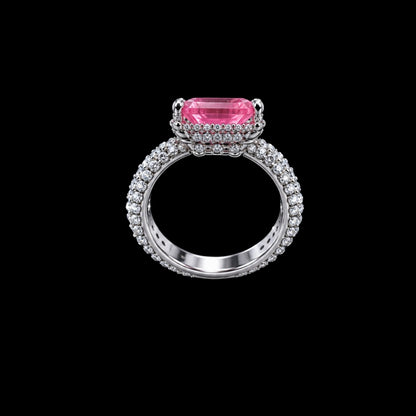 A silver-tone ring with a pink CZ stone and clear CZ accents.