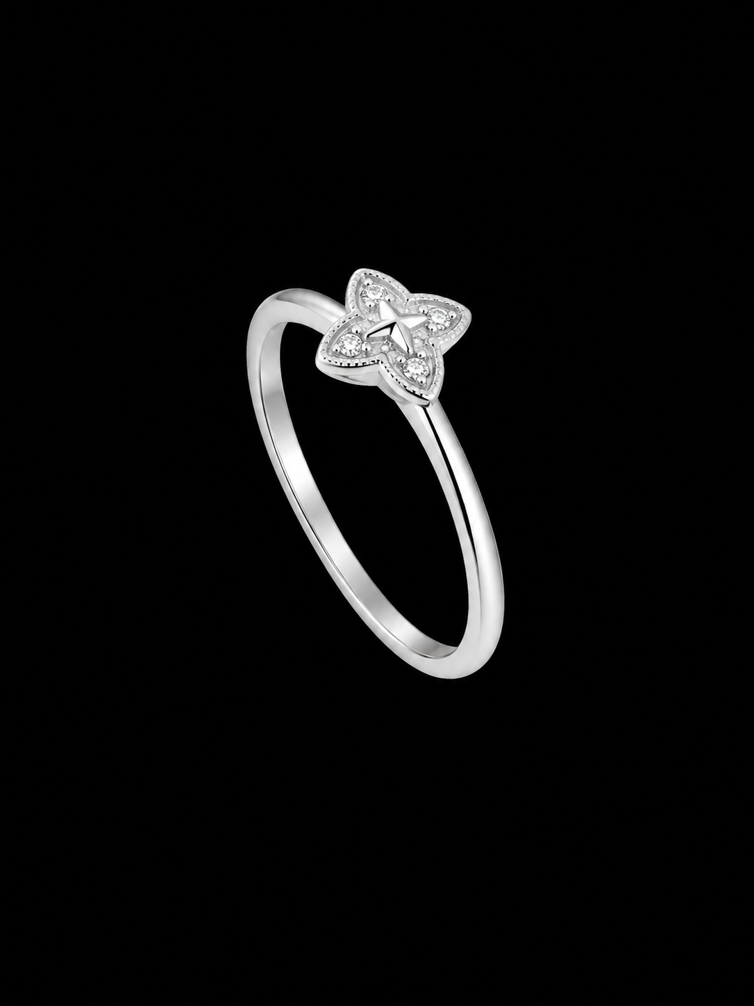 A silver ring with a star motif and CZ stones.