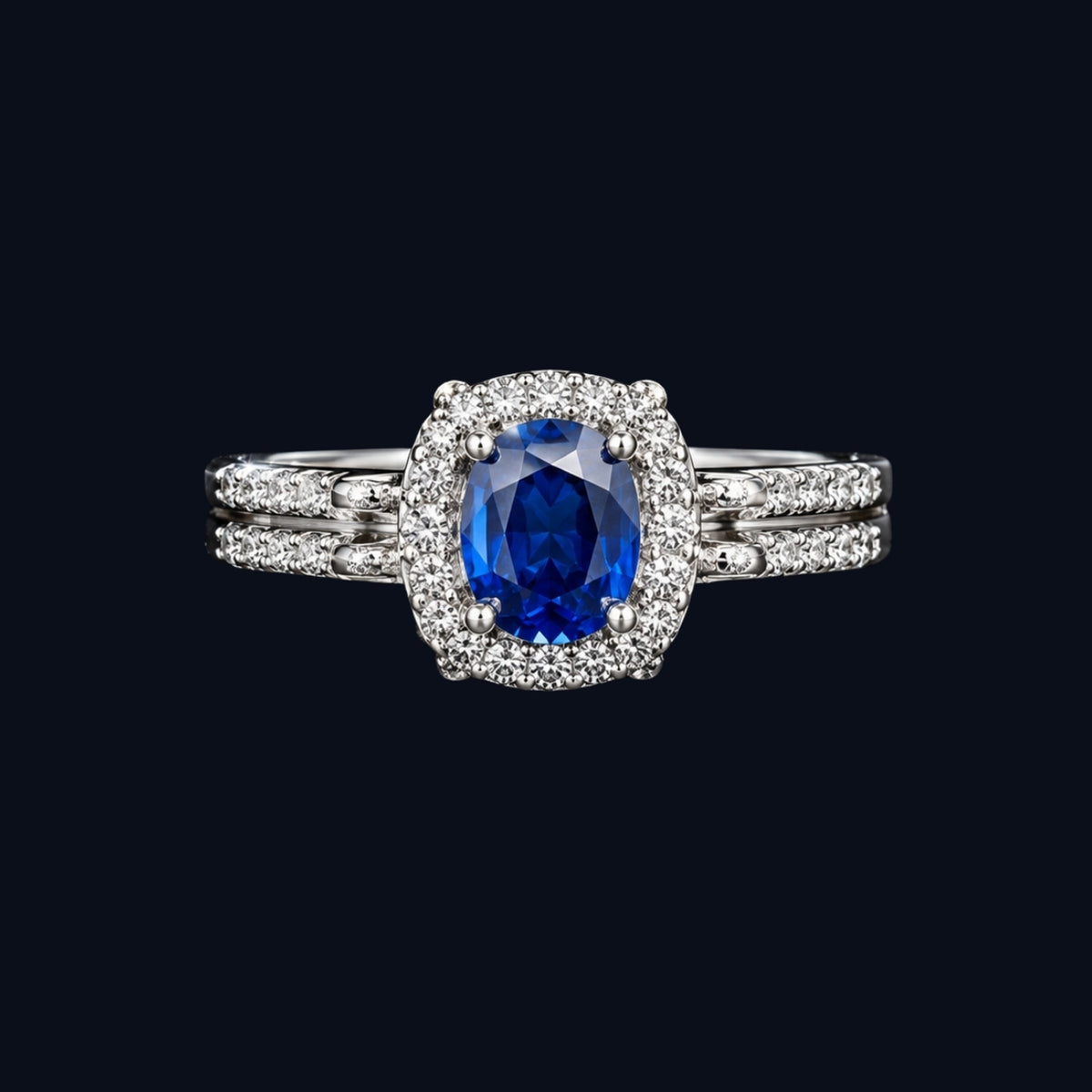 A silver ring with a blue sapphire stone and CZ stones