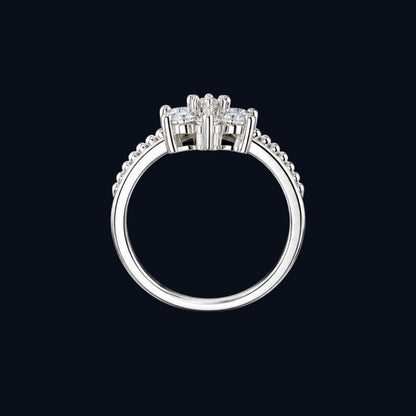 A silver ring with a cluster of clear cubic zirconia stones.