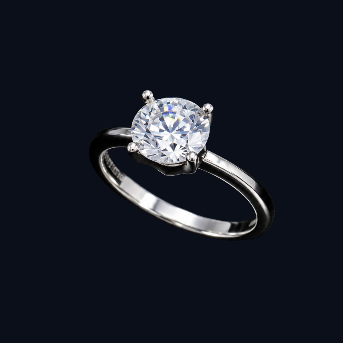 A silver-tone ring with an oval-cut cubic zirconia stone in a four-prong setting.