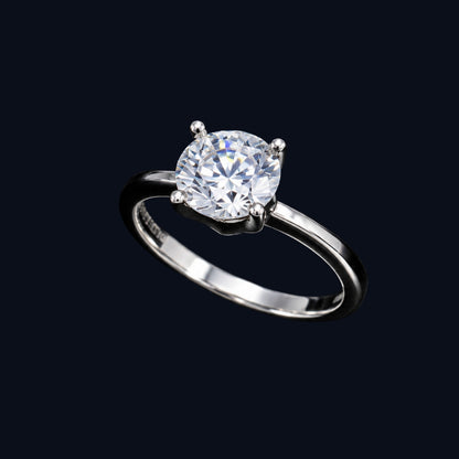 A silver-tone ring with an oval-cut cubic zirconia stone in a four-prong setting.