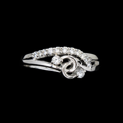 A silver ring with a swirl design and CZ stones.