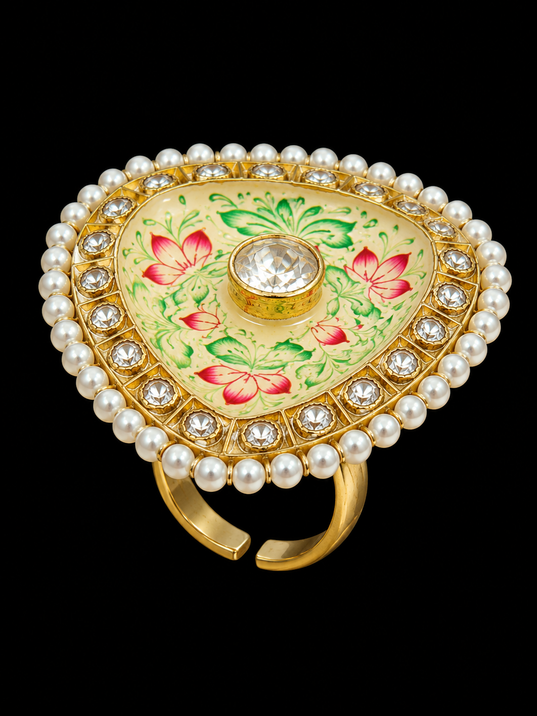 A gold-tone ring with a floral design and CZ stones.