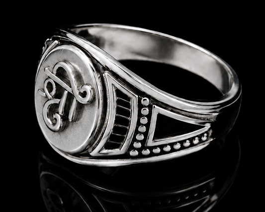 A silver ring with a round design and CZ stone detail.