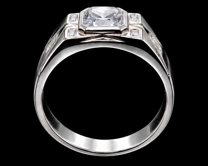 A silver ring with a large clear-cut CZ stone at its center, surrounded by smaller stones on either side.