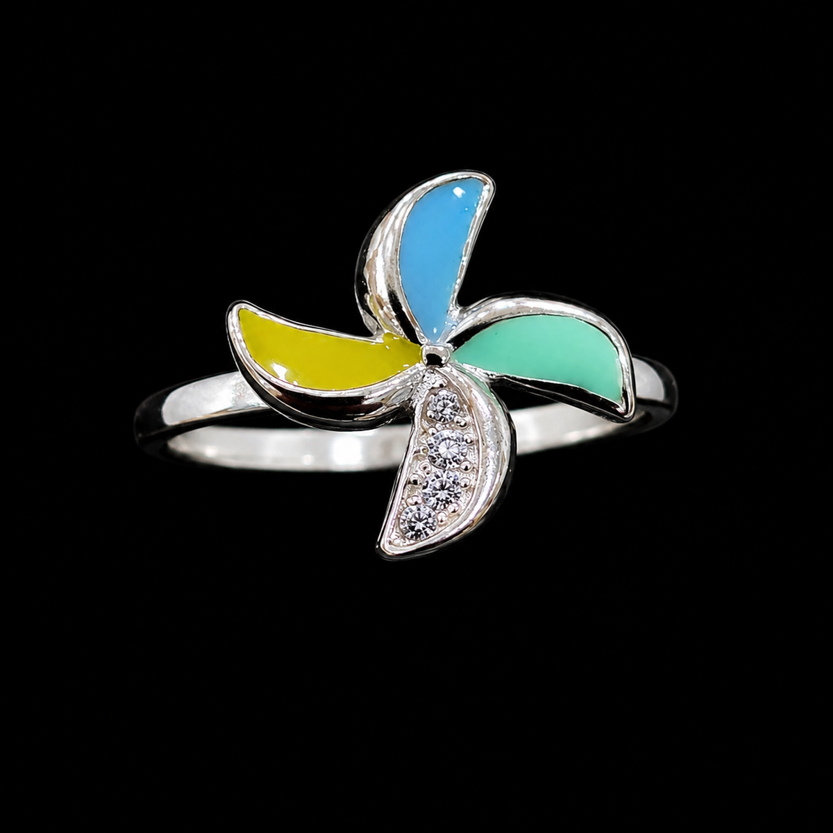 A silver-tone ring with a flower design and CZ stone.