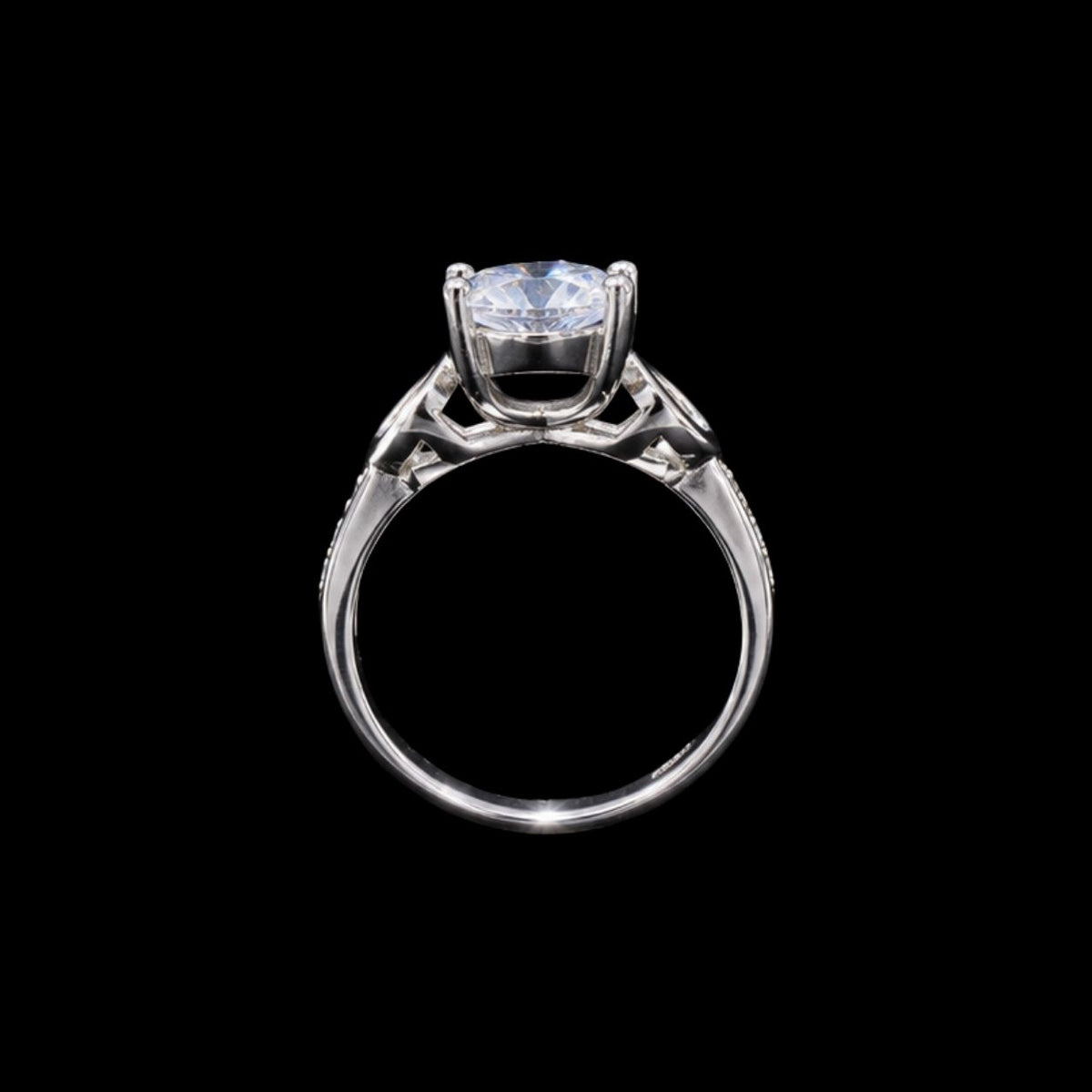 A silver-tone ring with a large, clear cubic zirconia stone.