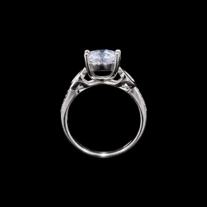 A silver-tone ring with a large, clear cubic zirconia stone.
